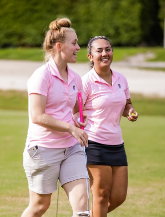 Girls Golf players walking on the green